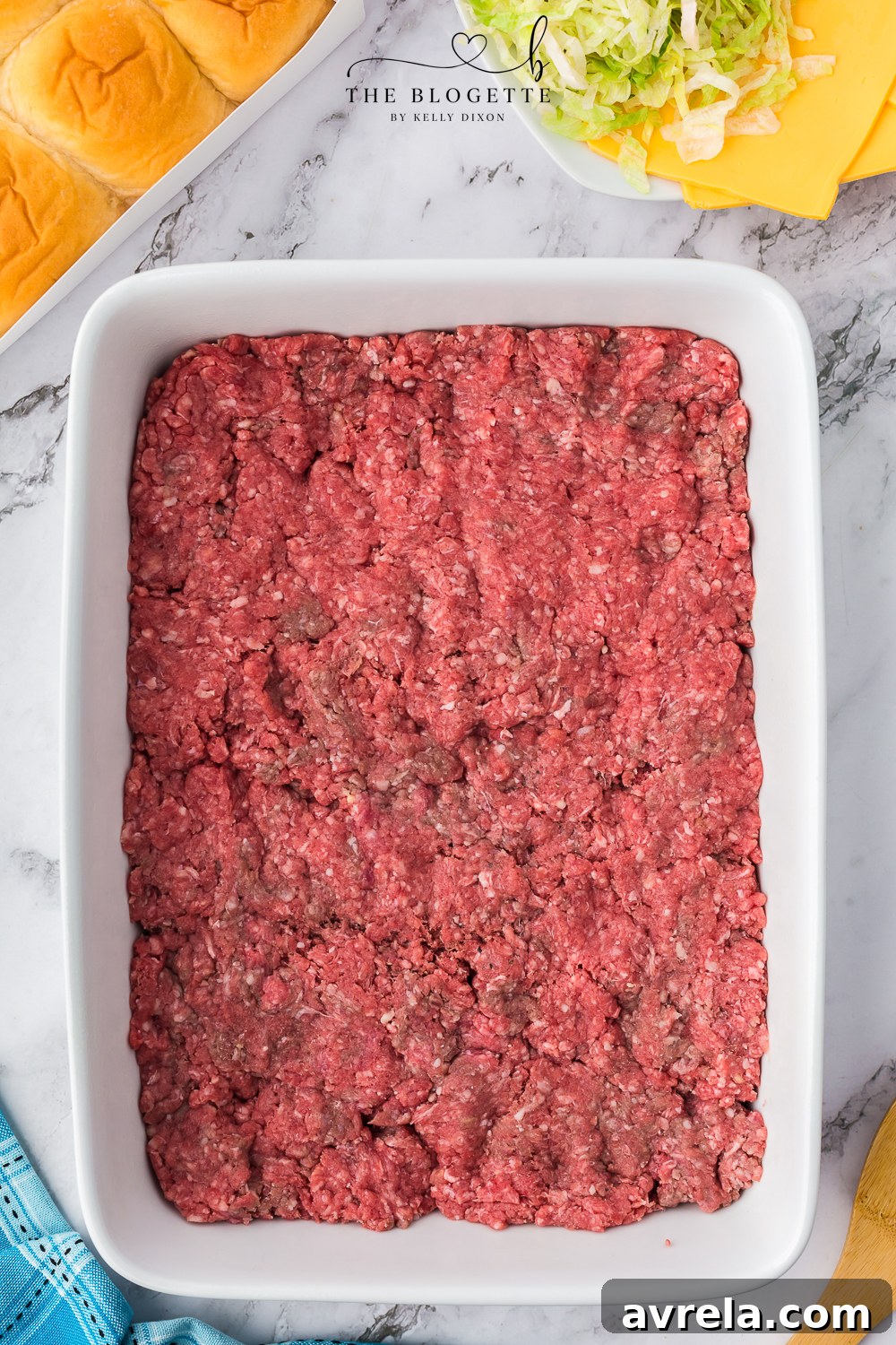 Mini Big Mac Bites 7 Ground beef seasoned and pressed into a baking dish, ready for the oven.
