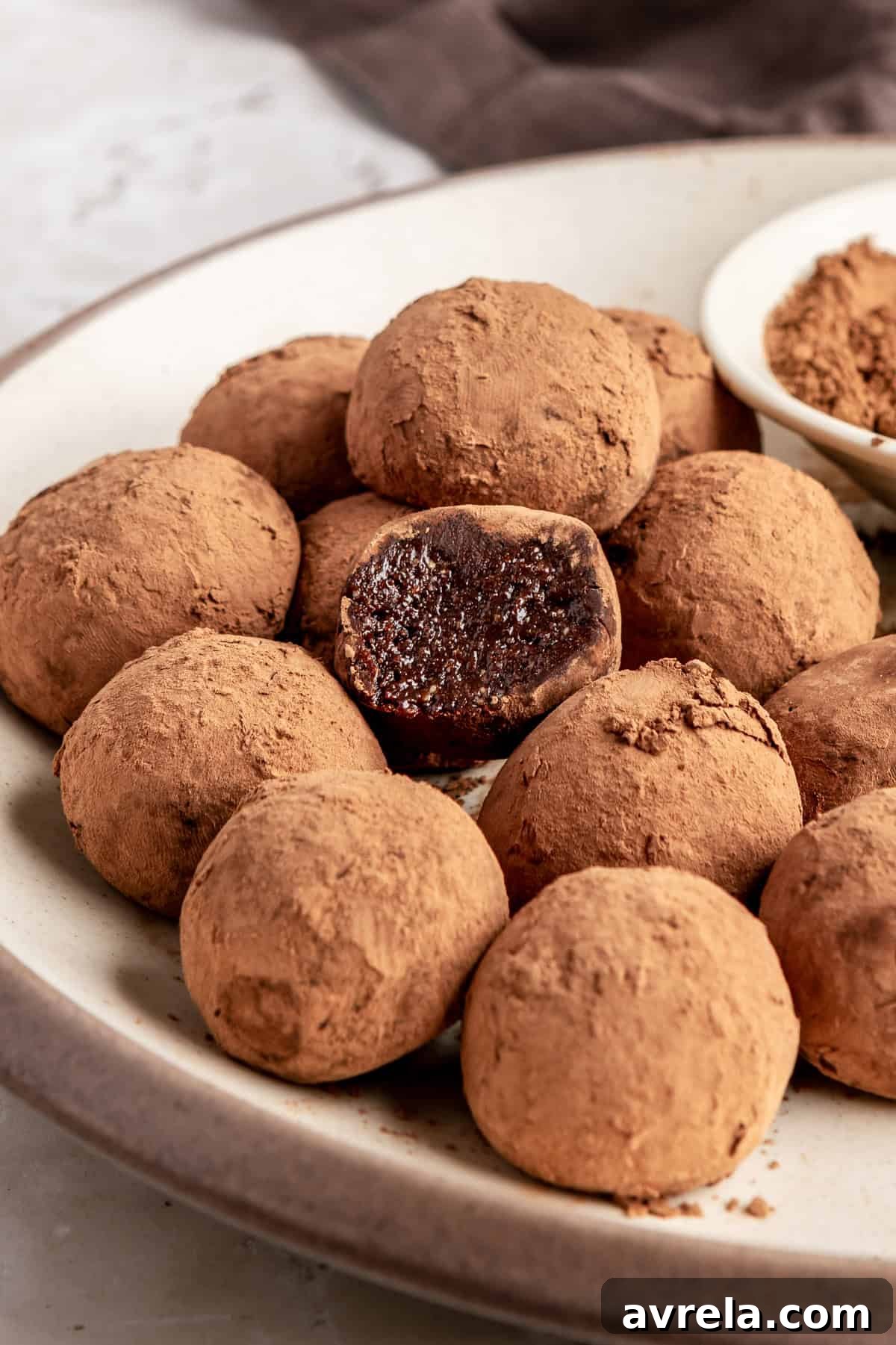 Finished protein brownie bites styled on a plate, rich and chocolatey no-bake snack