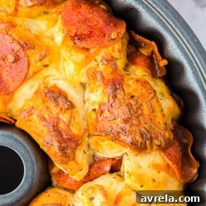 Easy Pull-Apart Pizza Bread with melted cheese and pepperoni, ready to serve.