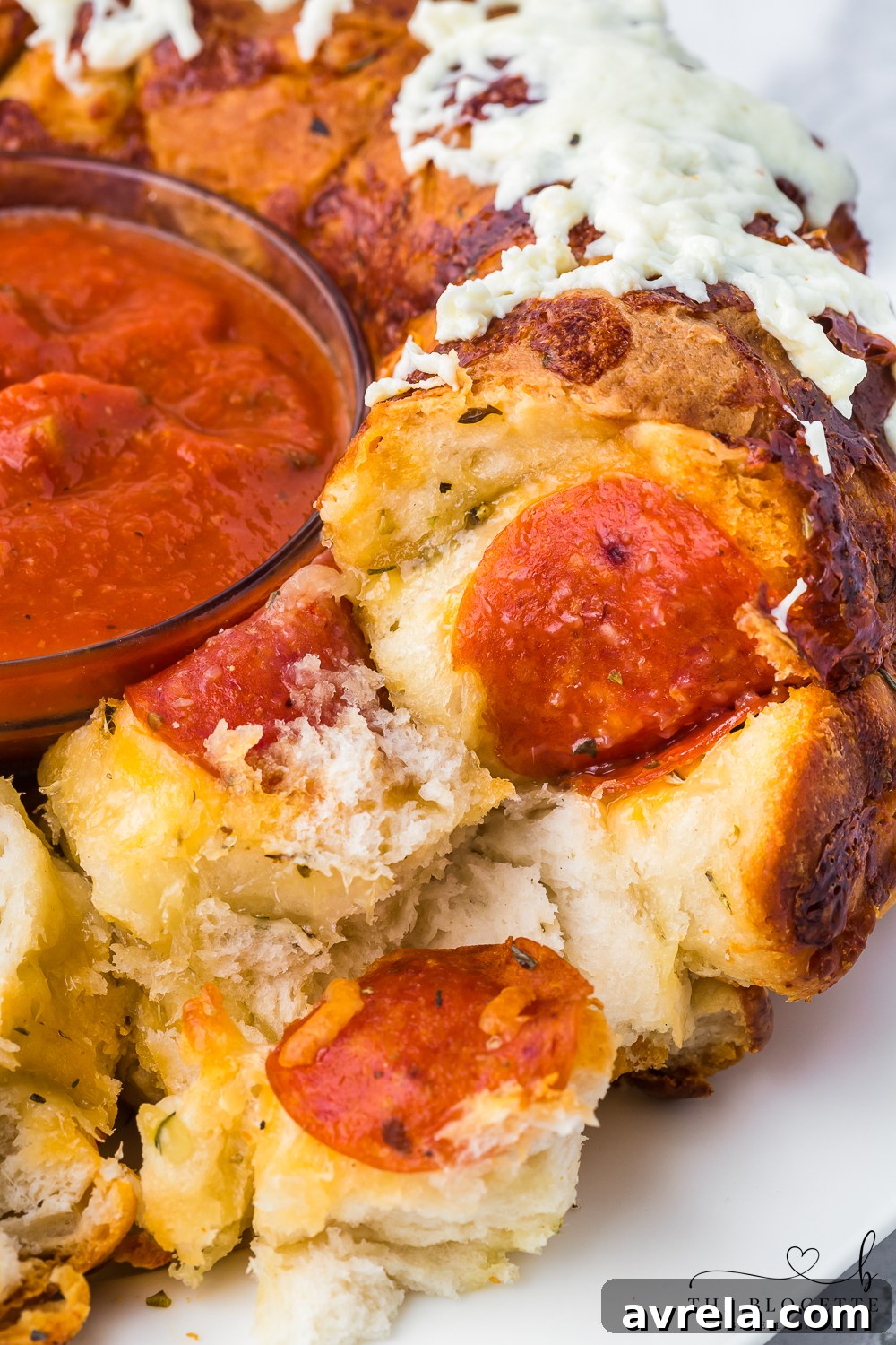 Cheesy Pizza Pull-Apart Bread 3 Close-up of baked Pull-Apart Pizza Bread, highlighting the melted cheese and pepperoni.