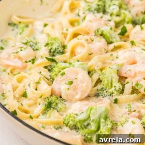 Shrimp Alfredo made with fettuccine, broccoli, and a quick and easy homemade Alfredo pasta sauce! Toss the ingredients in 1 pan and serve.