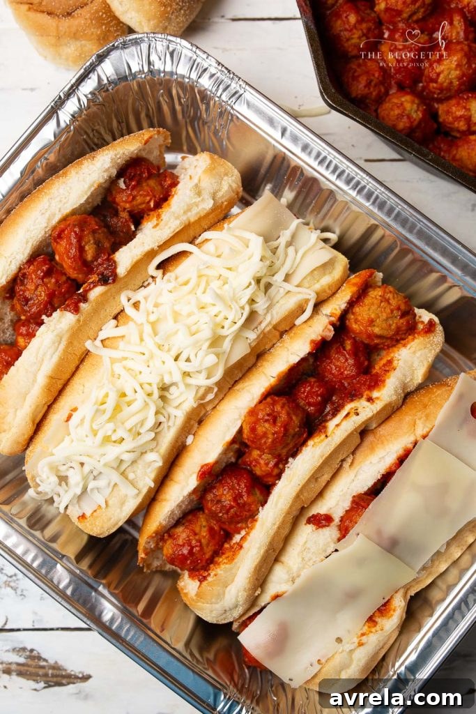 Baked Meatball Subs are packed with lots of melty cheese! Everyone loves this easy dinner. Baked with meatballs in a delicious marinara sauce and bubbly cheese on top.