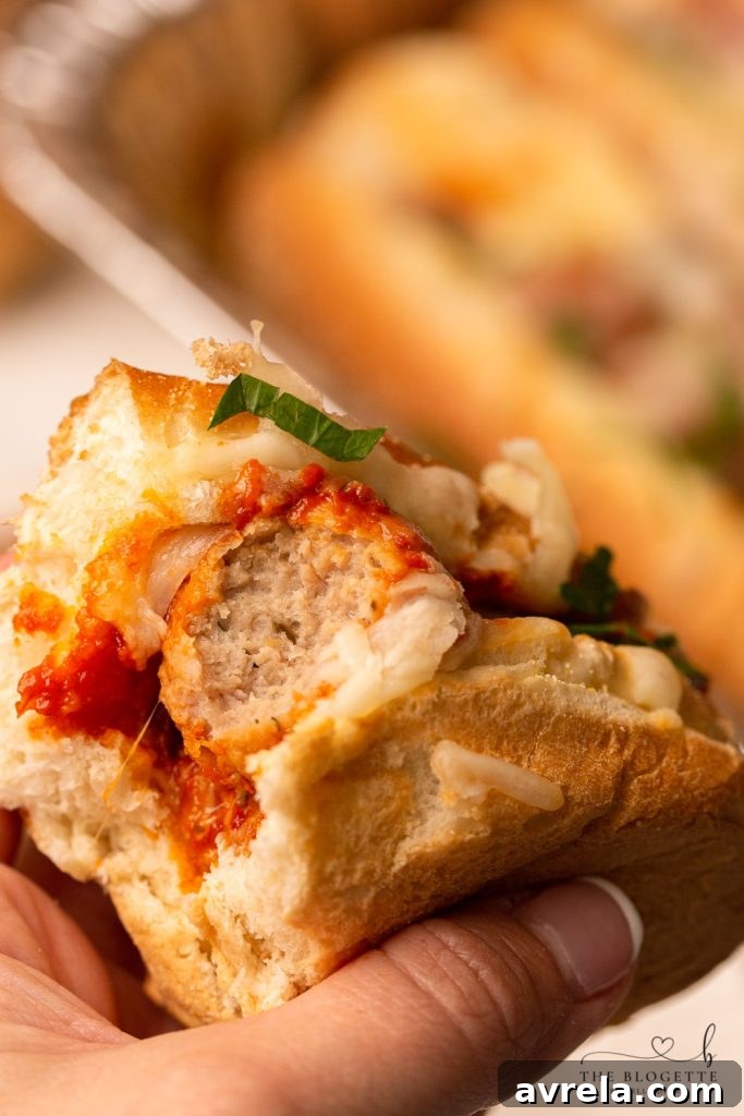 Baked Meatball Subs are packed with lots of melty cheese! Everyone loves this easy dinner. Baked with meatballs in a delicious marinara sauce and bubbly cheese on top.