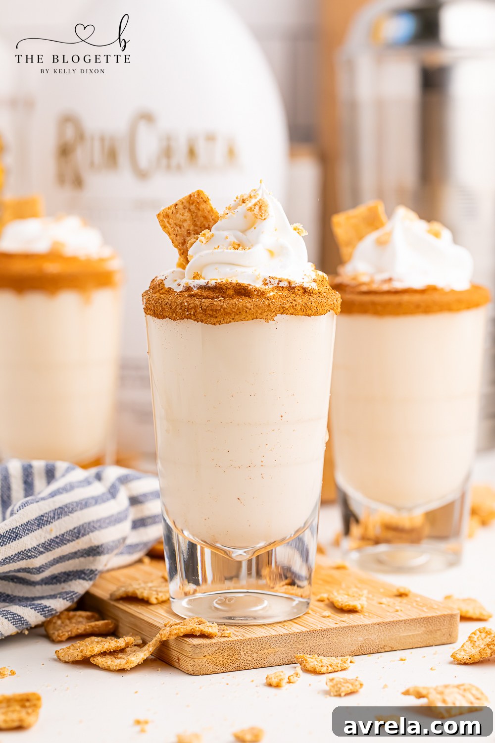 Toasted Spice Shooter 7 Cinnamon Toast Shots are a fun and festive mix of rum and whiskey! A rich and sweet cereal inspired drink topped with whipped cream.