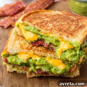 The ultimate Bacon Guacamole Grilled Cheese Sandwich, a hearty and flavorful meal.