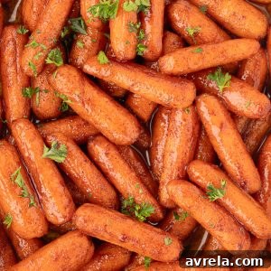 Roasted Baby Carrots are sweet, tender, and done in 30 minutes! A must-have during the holidays, but great for any weeknight dinner!