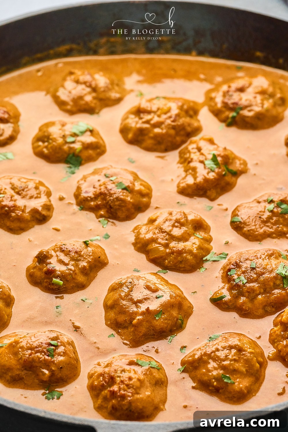 Velvety Makhani Sauce 3 Close-up of Butter Chicken Meatballs simmering in the rich, creamy sauce.