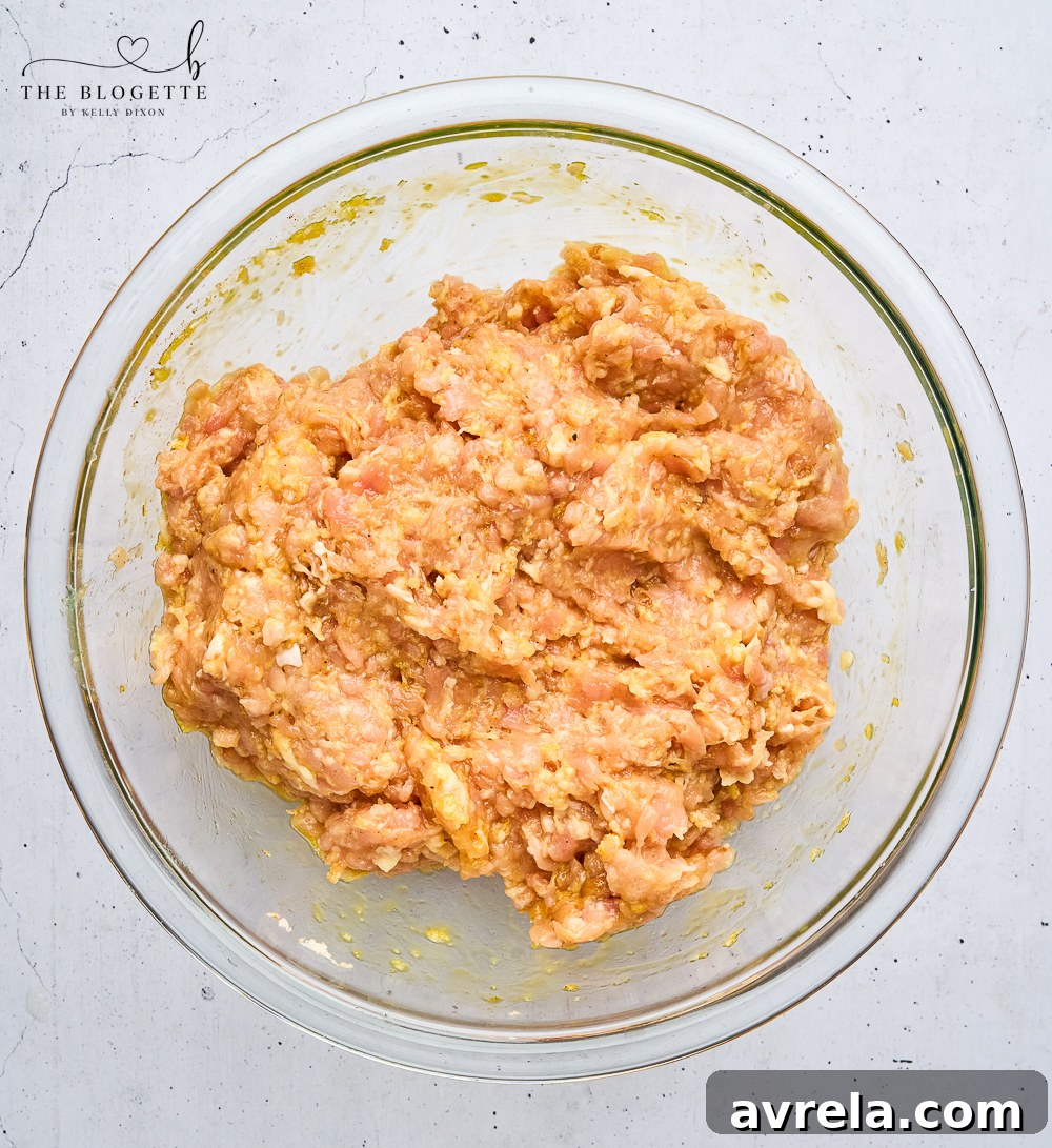 Velvety Makhani Sauce 5 Raw chicken meatballs mixed with panko, egg, and spices, ready for baking.