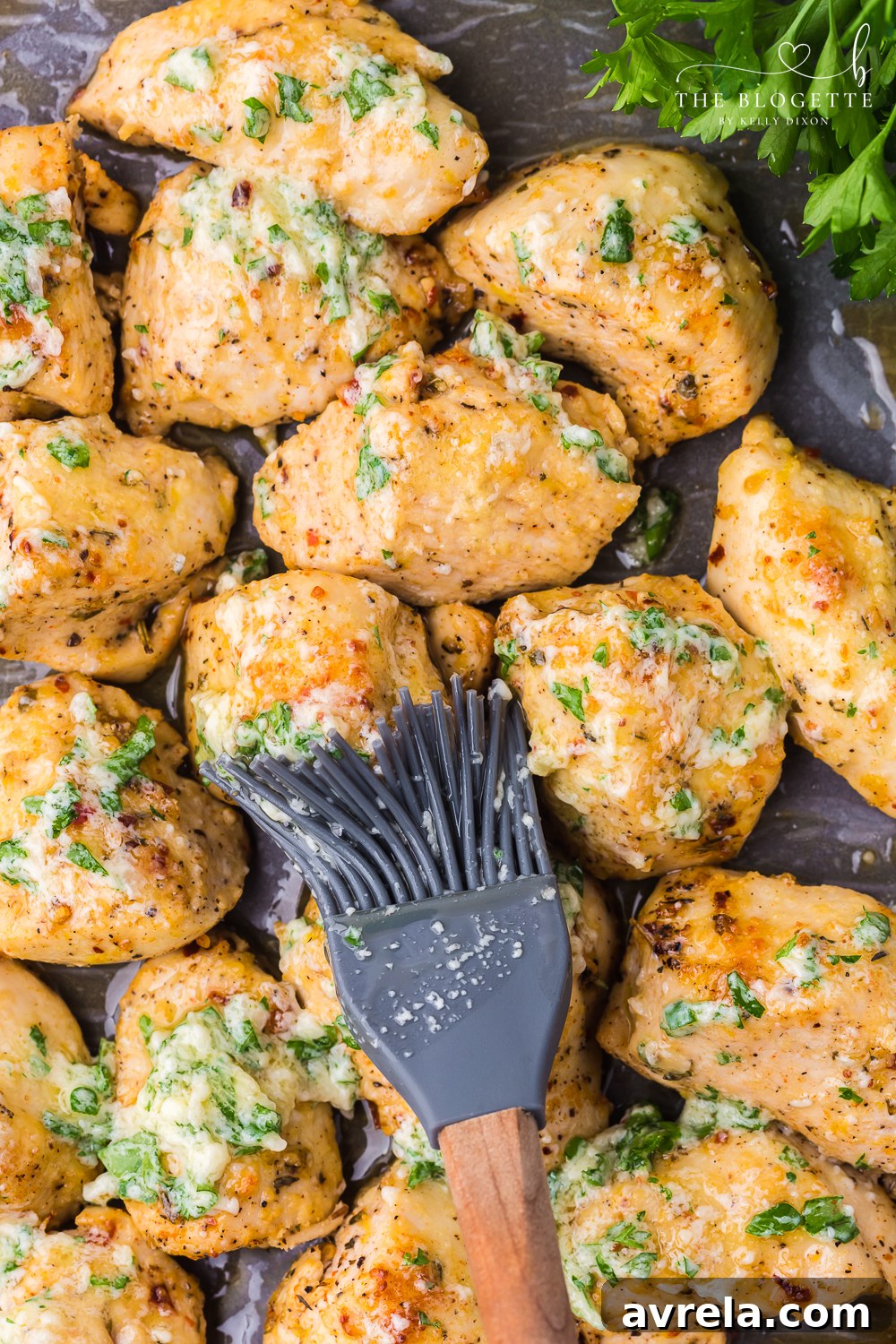 Garlic Parmesan Chicken offers a wonderful combination of savory and cheesy tastes. Tender, roasted chicken pieces are enveloped in a rich, comforting marinade, creating a truly satisfying dish.