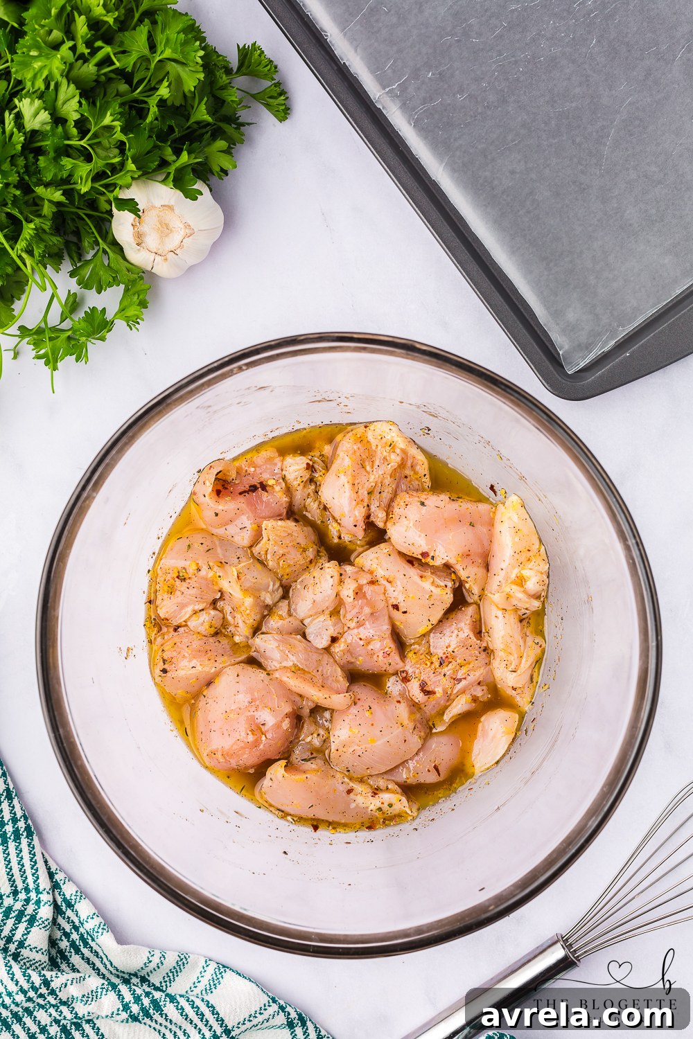 Chicken pieces marinating in a flavorful blend, absorbing rich spices and herbs to tenderize and enhance their taste before cooking.