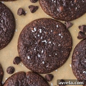 Close-up of freshly baked chocolate brownie cookies with crackly tops.