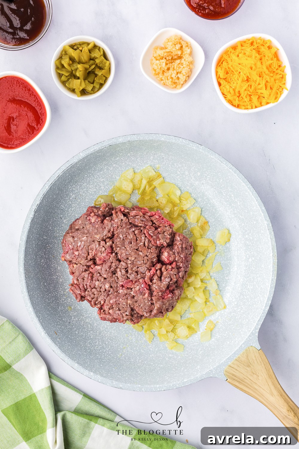 Skillet Sloppy Joes 7 Diced sweet onions sizzling in butter in a heavy-bottomed skillet, becoming translucent.