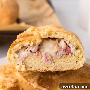 How to make a Costco Chicken Bake at home! Fluffy dough wrapped around chicken, cheese, and bacon and drizzled with Caesar dressing.