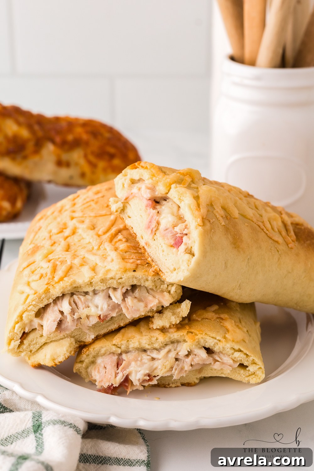 Cross-section of a homemade Costco Chicken Bake, revealing the creamy chicken, cheese, and bacon filling.