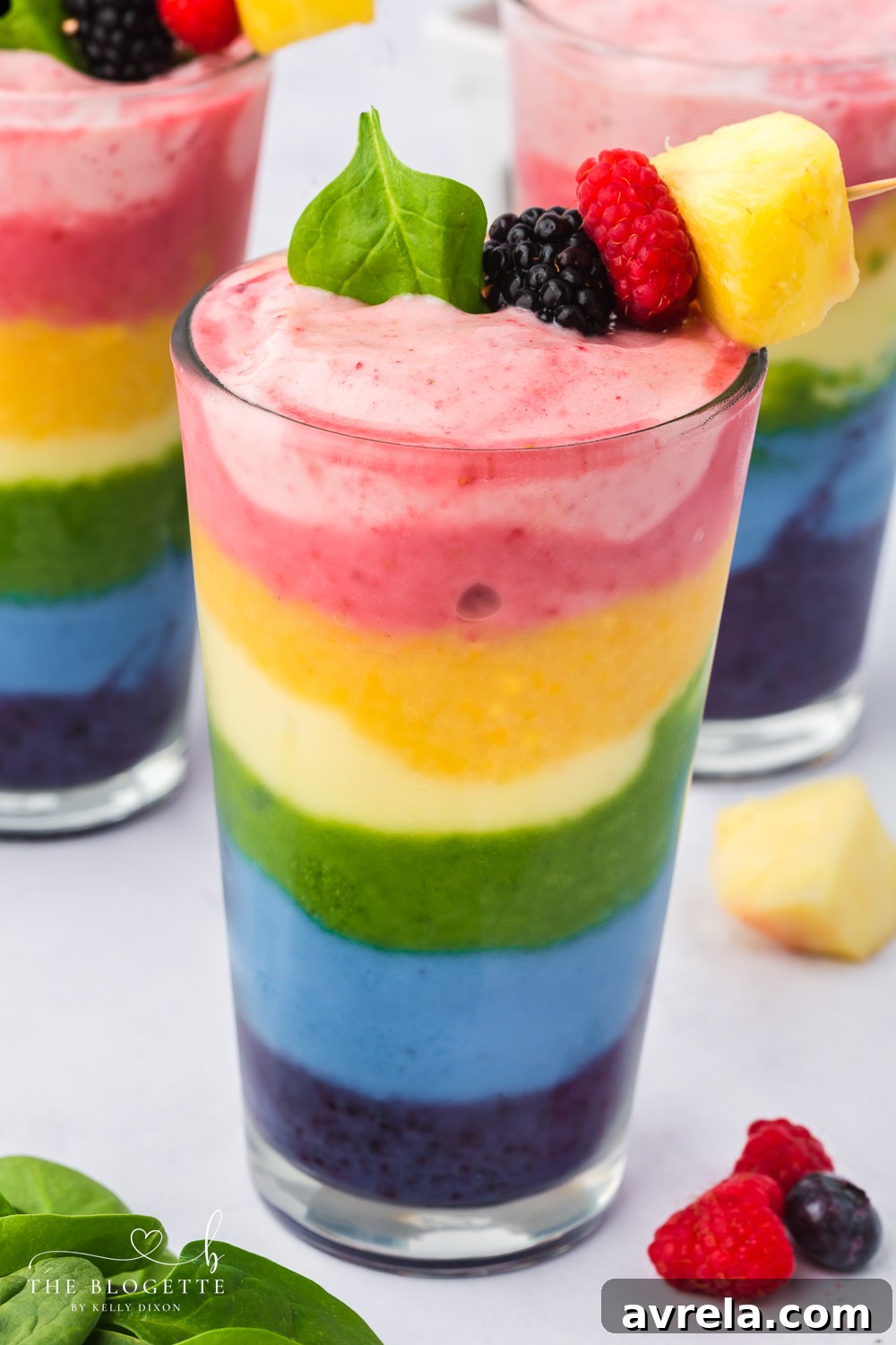 Kaleidoscope Smoothie 2 Rainbow Smoothie - packed with fruit and is perfect for breakfast or a healthy treat! It's also a fun rainbow recipe for St. Patrick's Day.