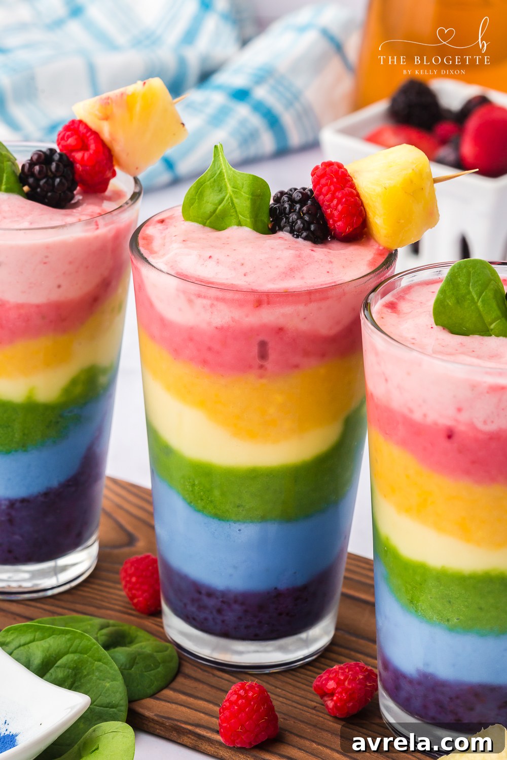 Kaleidoscope Smoothie 3 Rainbow Smoothie - packed with fruit and is perfect for breakfast or a healthy treat! It's also a fun rainbow recipe for St. Patrick's Day.