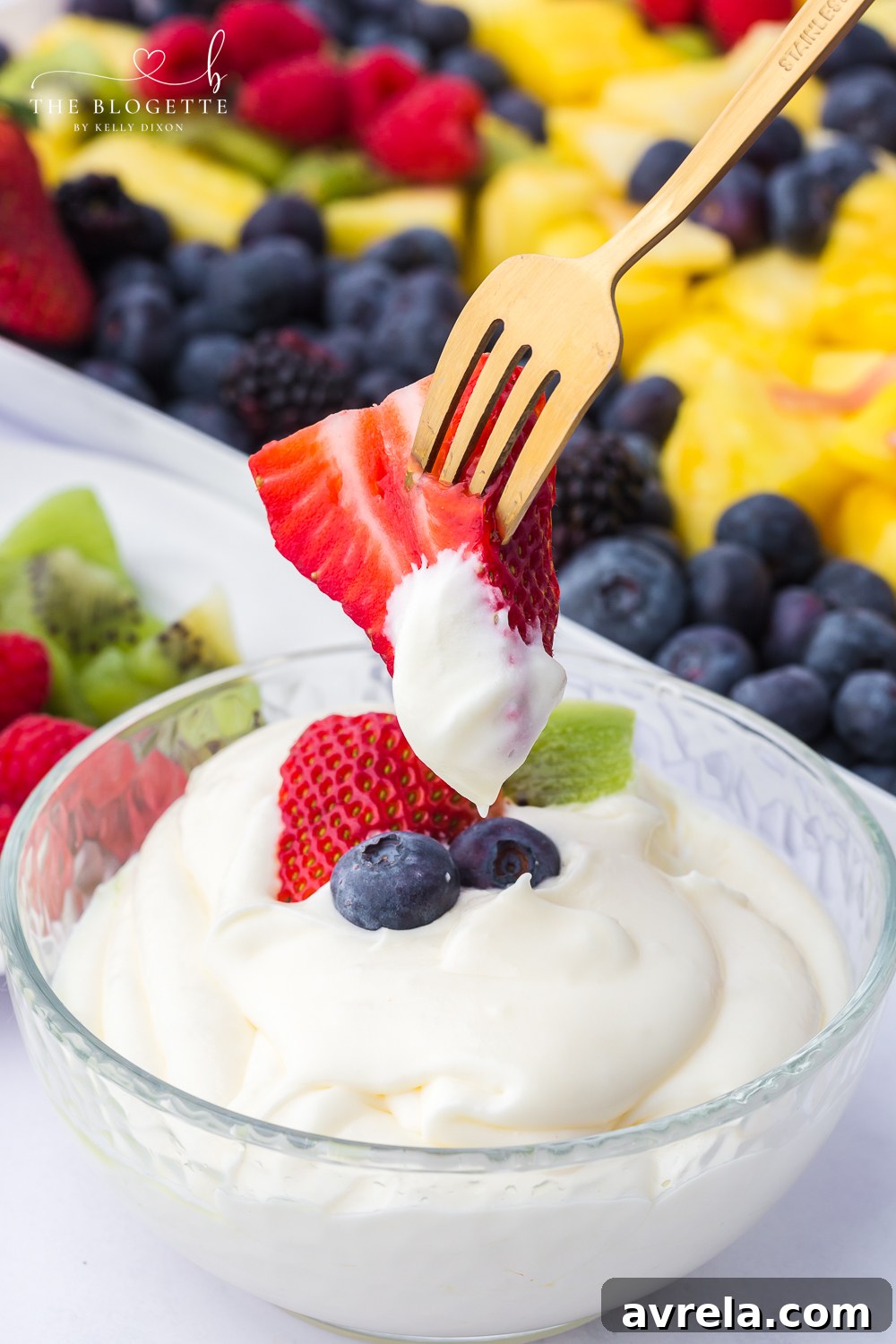 Luscious Fruit Dip 3 Creamy marshmallow cream cheese fruit dip served on a platter with various fresh fruits.