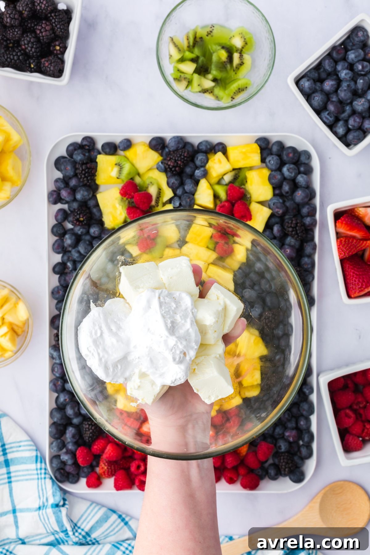 Luscious Fruit Dip 4 Three simple ingredients for fruit dip: cream cheese, marshmallow fluff, and almond extract.