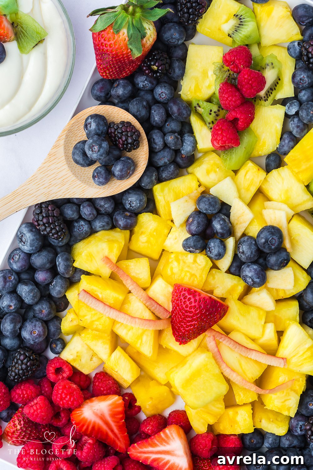 Colorful Easter Fruit Medley 12 The finished Easter Fruit Platter with a bowl of creamy fruit dip placed alongside, ready to serve.