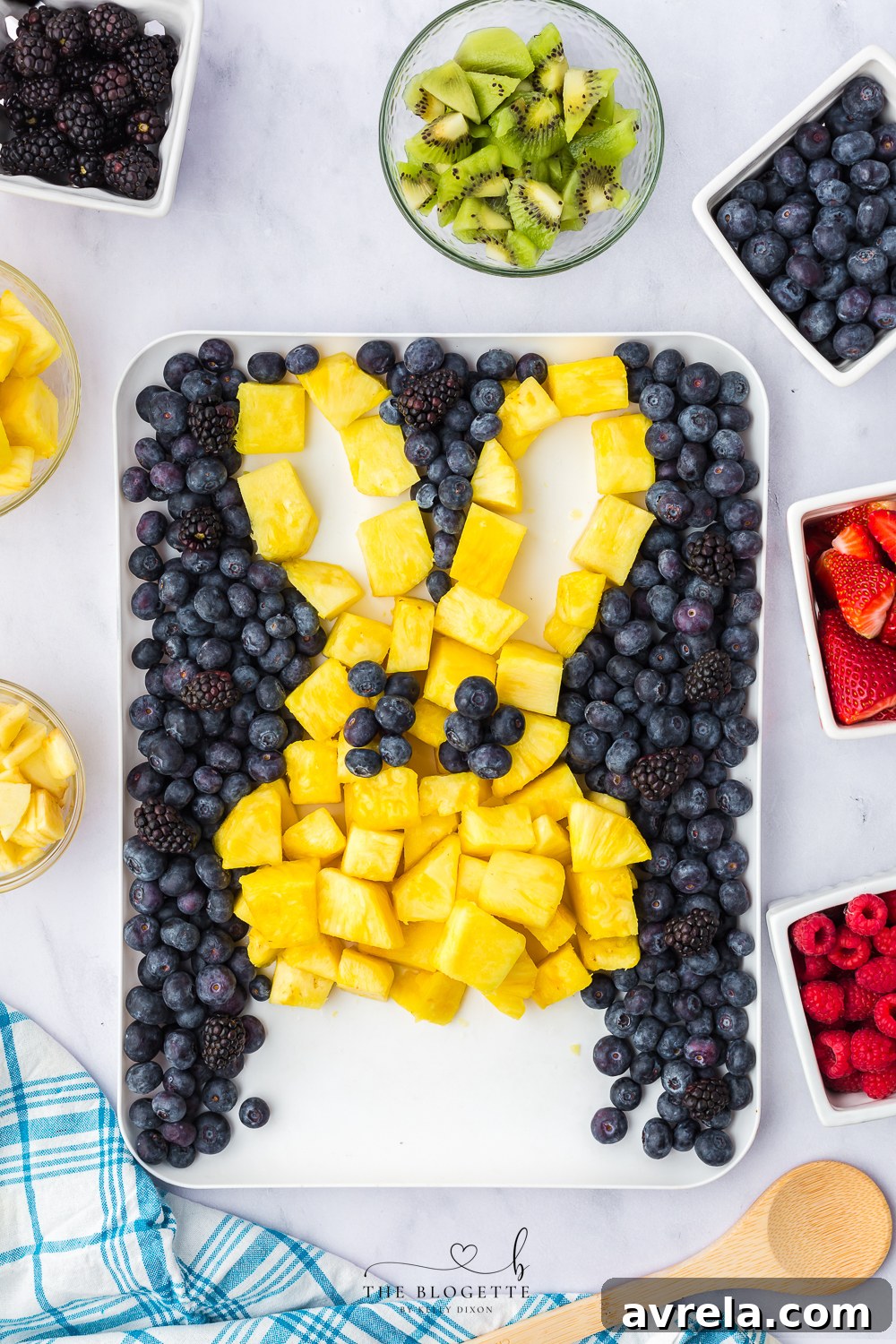 Colorful Easter Fruit Medley 7 Assembling the fruit bunny, showing the ears and initial face details.