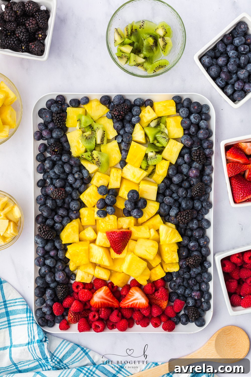Colorful Easter Fruit Medley 9 Easter Bunny Fruit Plate showing ears filled with raspberries and kiwi.