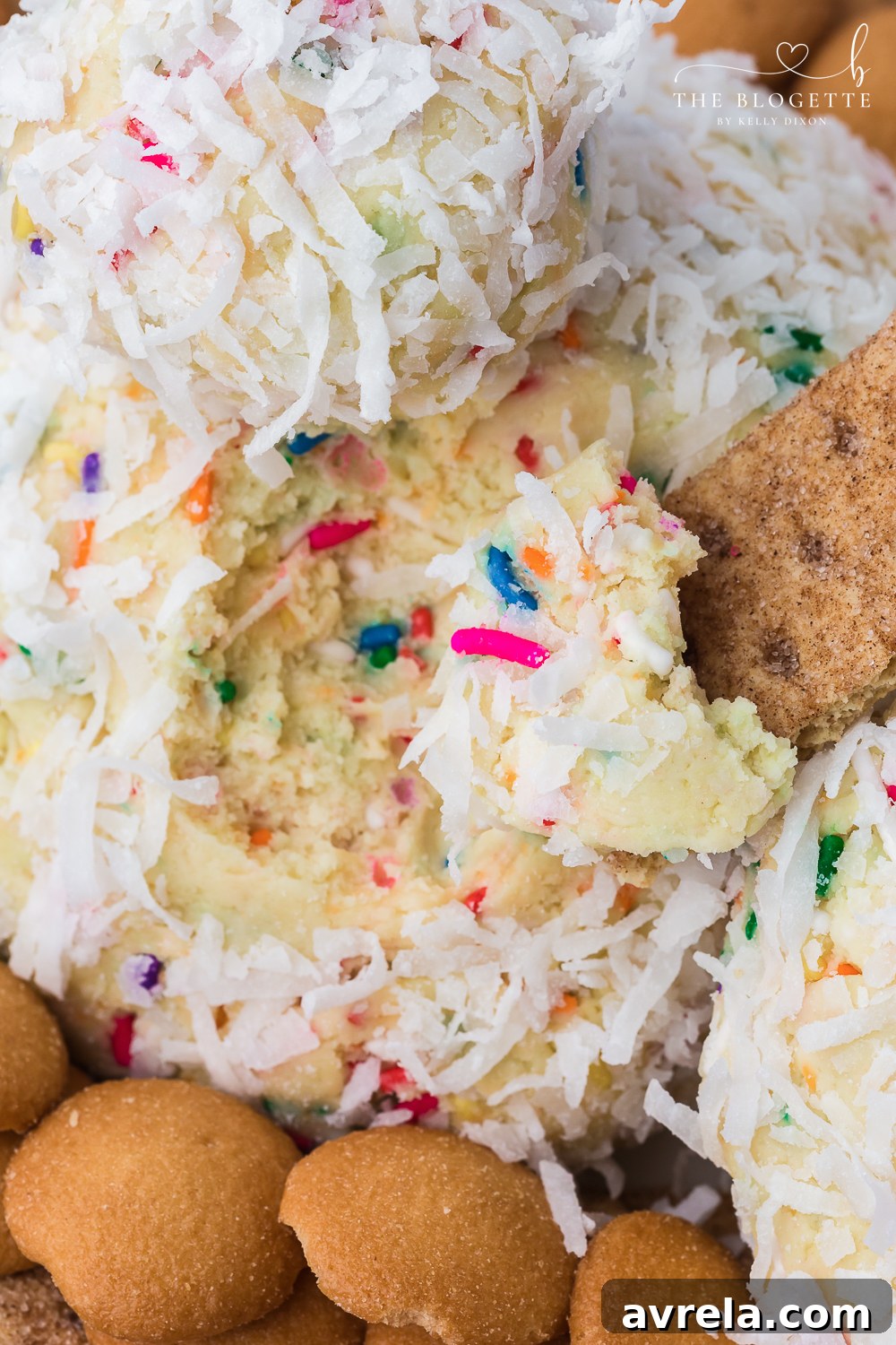 The festive Easter Cheeseball served on a platter with various sweet dipping options, ready for guests to enjoy at a spring party.