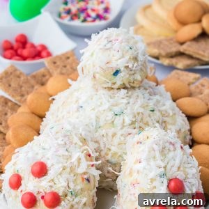 A delightful Bunny Butt Cheeseball, a whimsical and delicious Easter dessert idea, shown on a white platter with dippers.