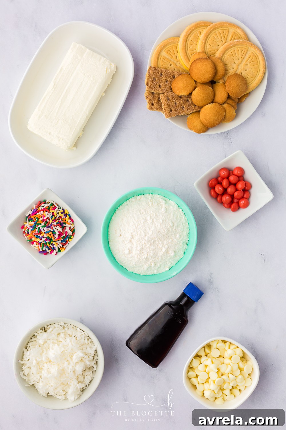 All the fresh ingredients laid out for making the Bunny Butt Cheeseball, including softened cream cheese, white chocolate chips, colorful sprinkles, cake mix, almond extract, and sweetened coconut flakes, ready for preparation.