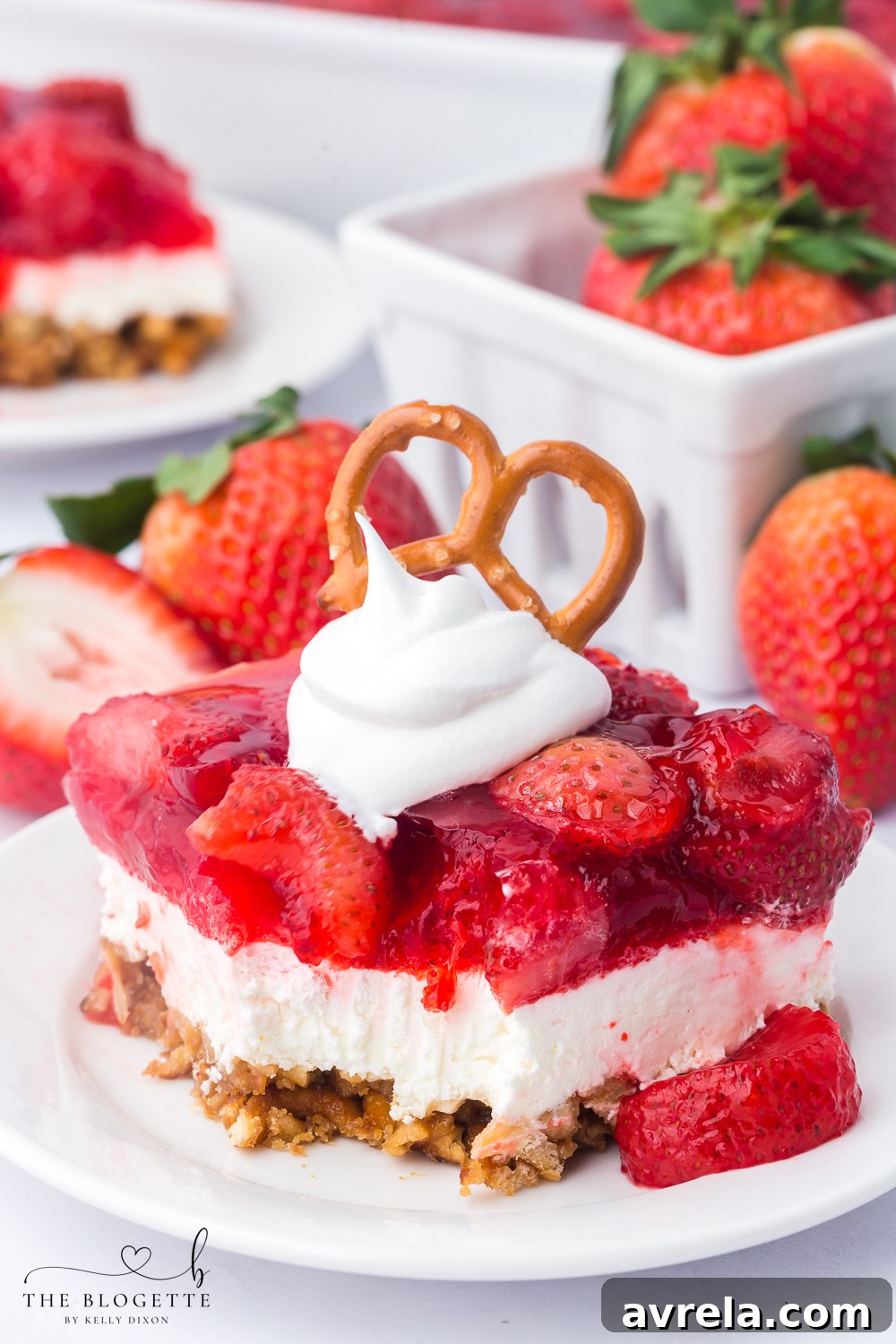 Strawberry Pretzel Salad recipe! Pretzel crust with a creamy layer of cream cheese and whipped topping, topped with Jello and strawberries!
