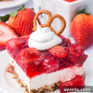 Strawberry Pretzel Salad recipe! Pretzel crust with a creamy layer of cream cheese and whipped topping, topped with Jello and strawberries!