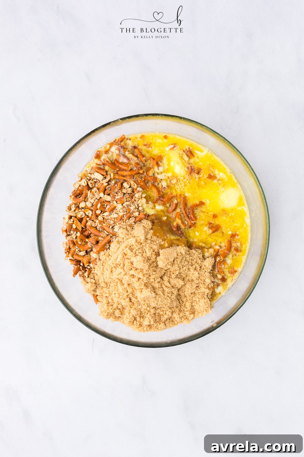 stir together the pretzels, melted butter, and light brown sugar