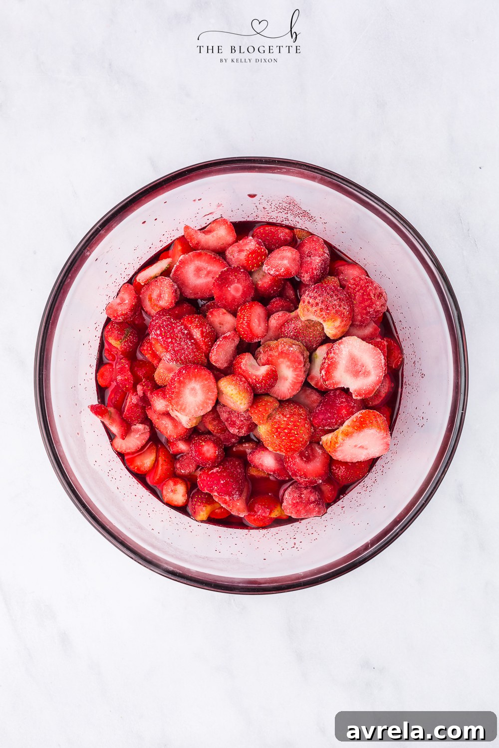 Make the Jello and add the strawberries