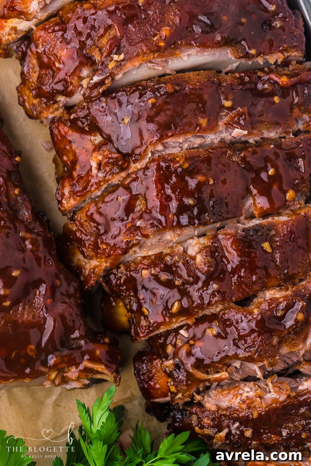 Ultimate Oven-Baked Ribs 15 Baked Ribs - Tender ribs seasoned with a bold, flavorful sauce are baked in the oven until the meat is fall-off-the-bone. Comfort on a plate!
