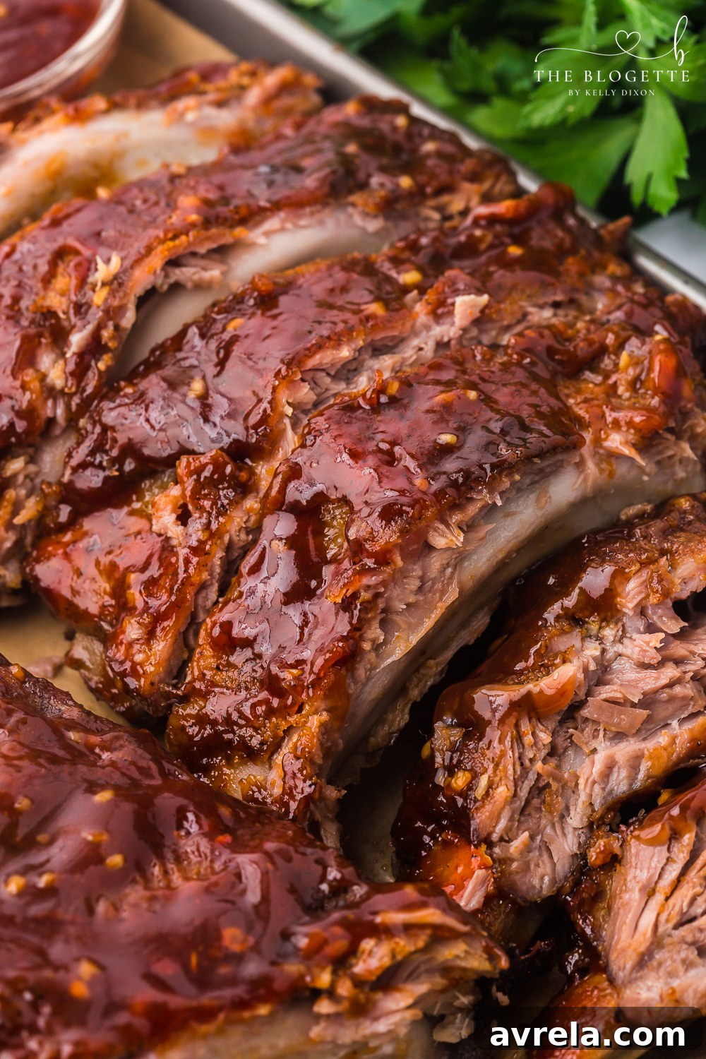 Ultimate Oven-Baked Ribs 17 Baked Ribs - Tender ribs seasoned with a bold, flavorful sauce are baked in the oven until the meat is fall-off-the-bone. Comfort on a plate!
