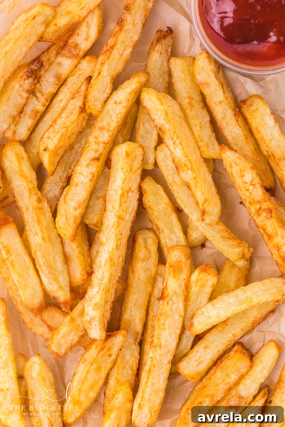 These homemade French fries are delicious and shockingly easy to make. Hand-cut and double-fried for that perfect golden crunch.