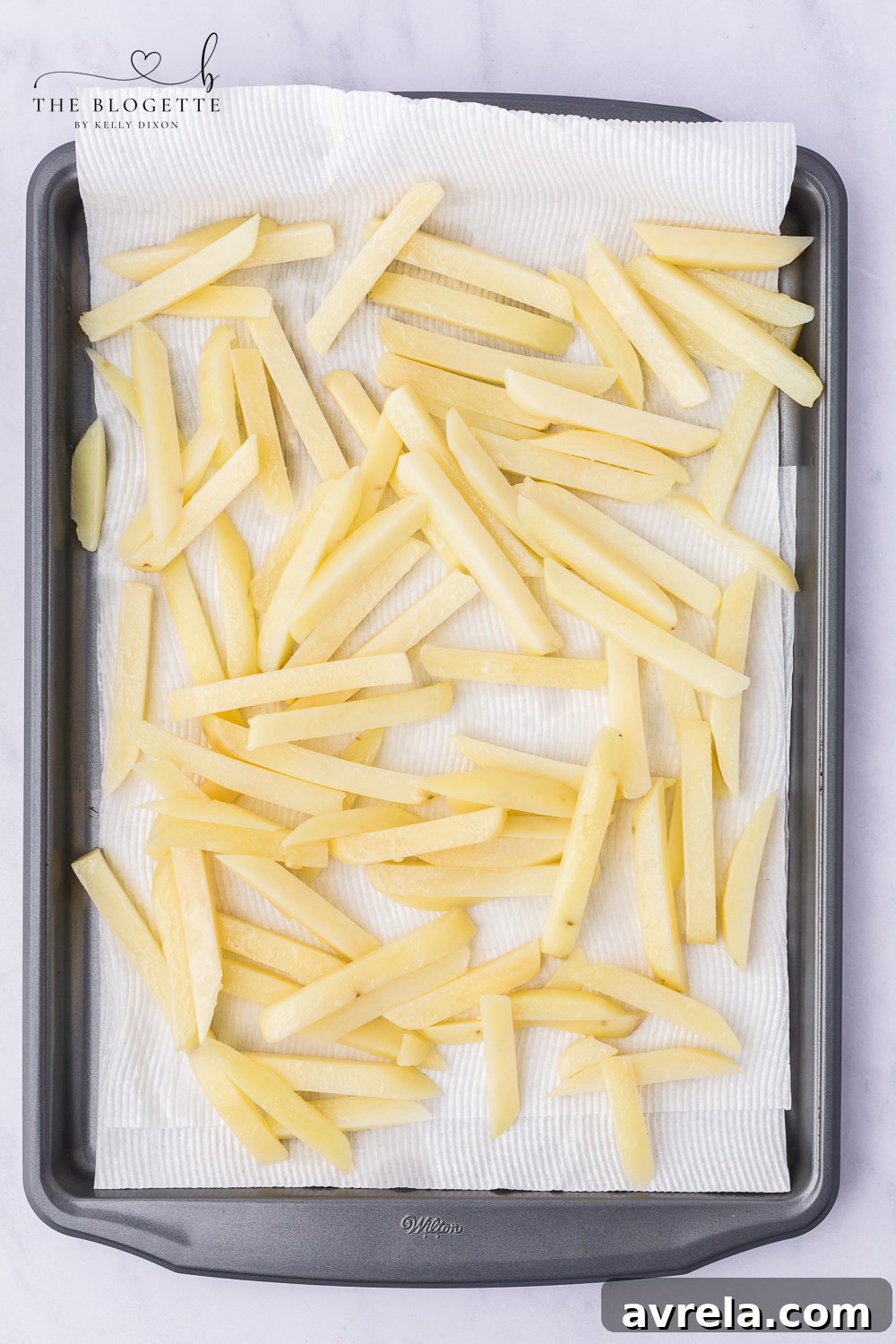 Place the fries on paper towels to drain