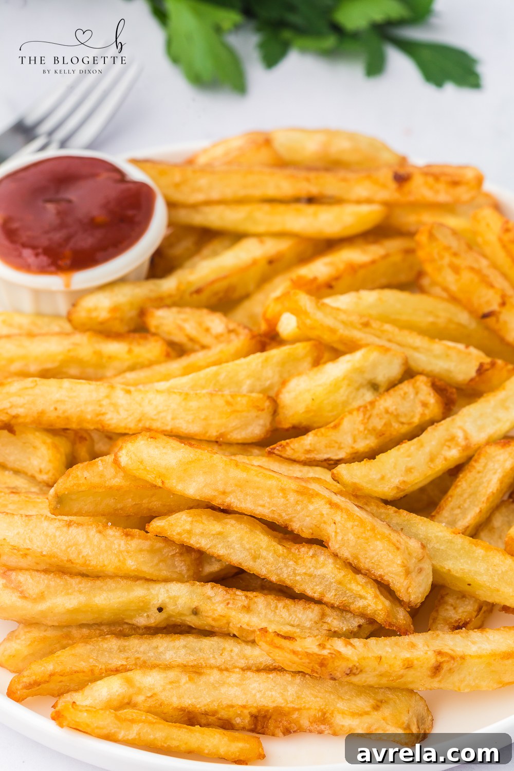 These homemade French fries are delicious and shockingly easy to make. Hand-cut and double-fried for that perfect golden crunch.