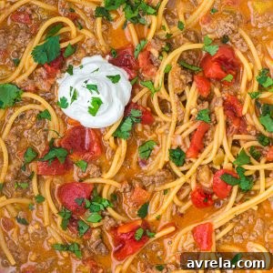 Easy One-Pot Taco Spaghetti (Cheesy Tex-Mex Pasta). Fast and flavorful - all the best taco flavors with classic comfort food spaghetti.