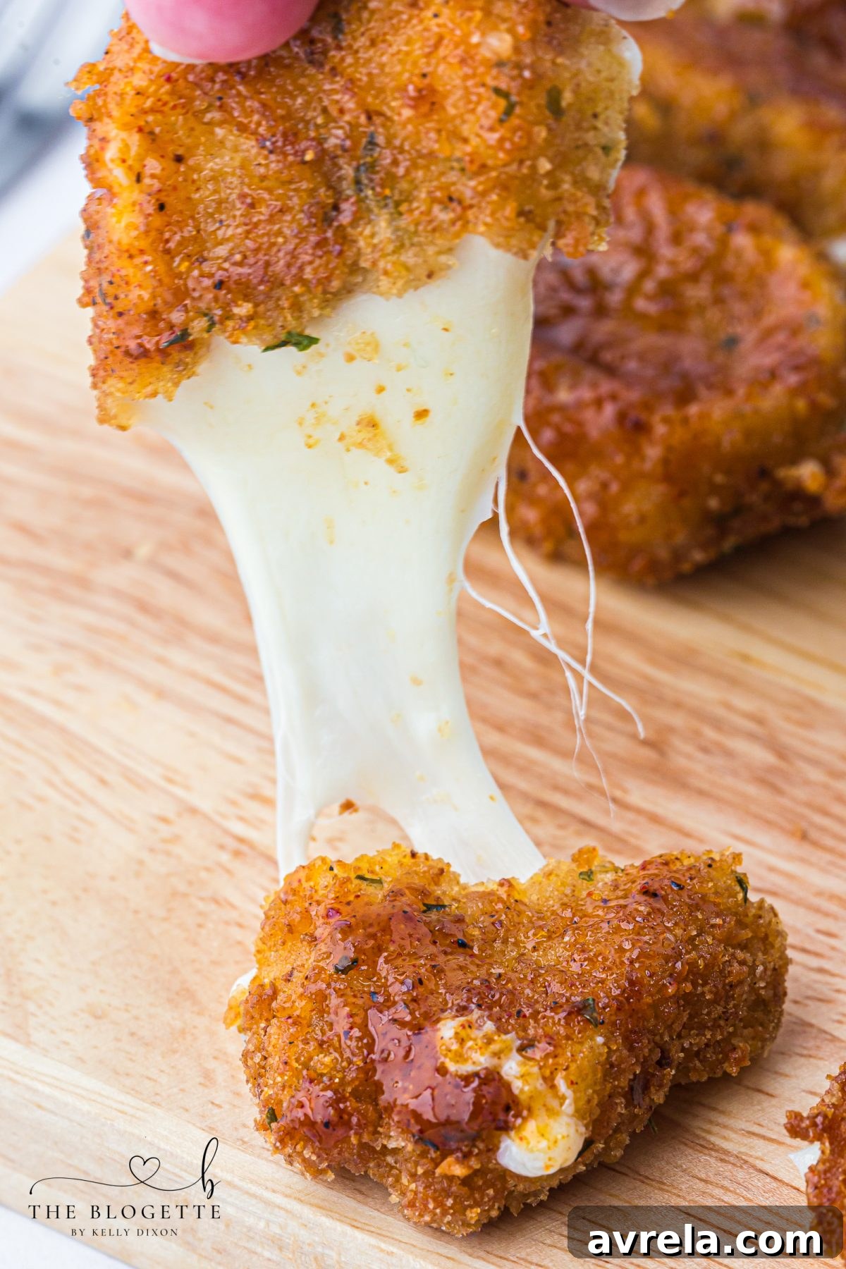 Crispy, gooey, and spicy Nashville Hot Mozzarella Sticks, perfect for an irresistible appetizer or game day snack.