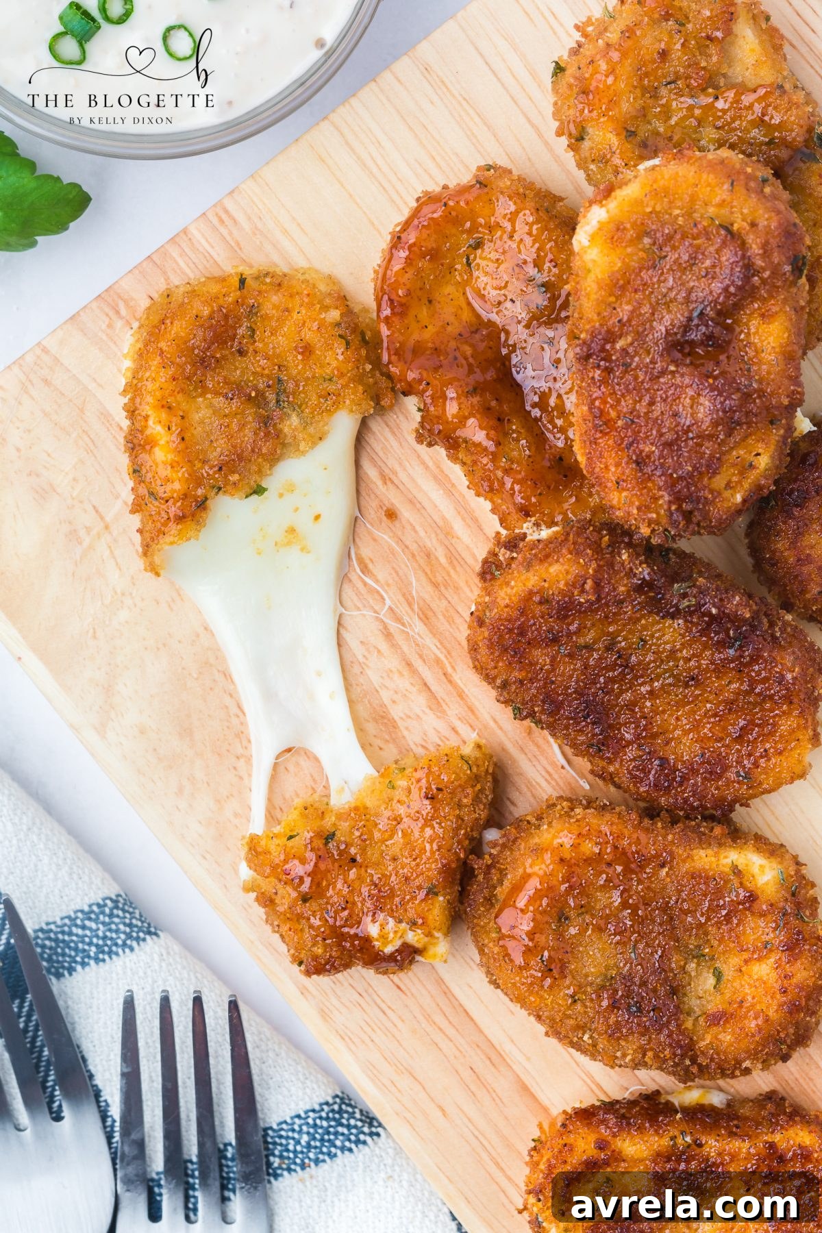 A delicious plate of Nashville Hot Mozzarella Sticks with ranch dressing on the side, ready for serving.