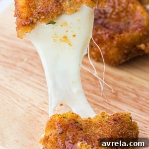 Crispy, gooey, spicy, and totally irresistible Nashville Hot Mozzarella Sticks, an ultimate appetizer.