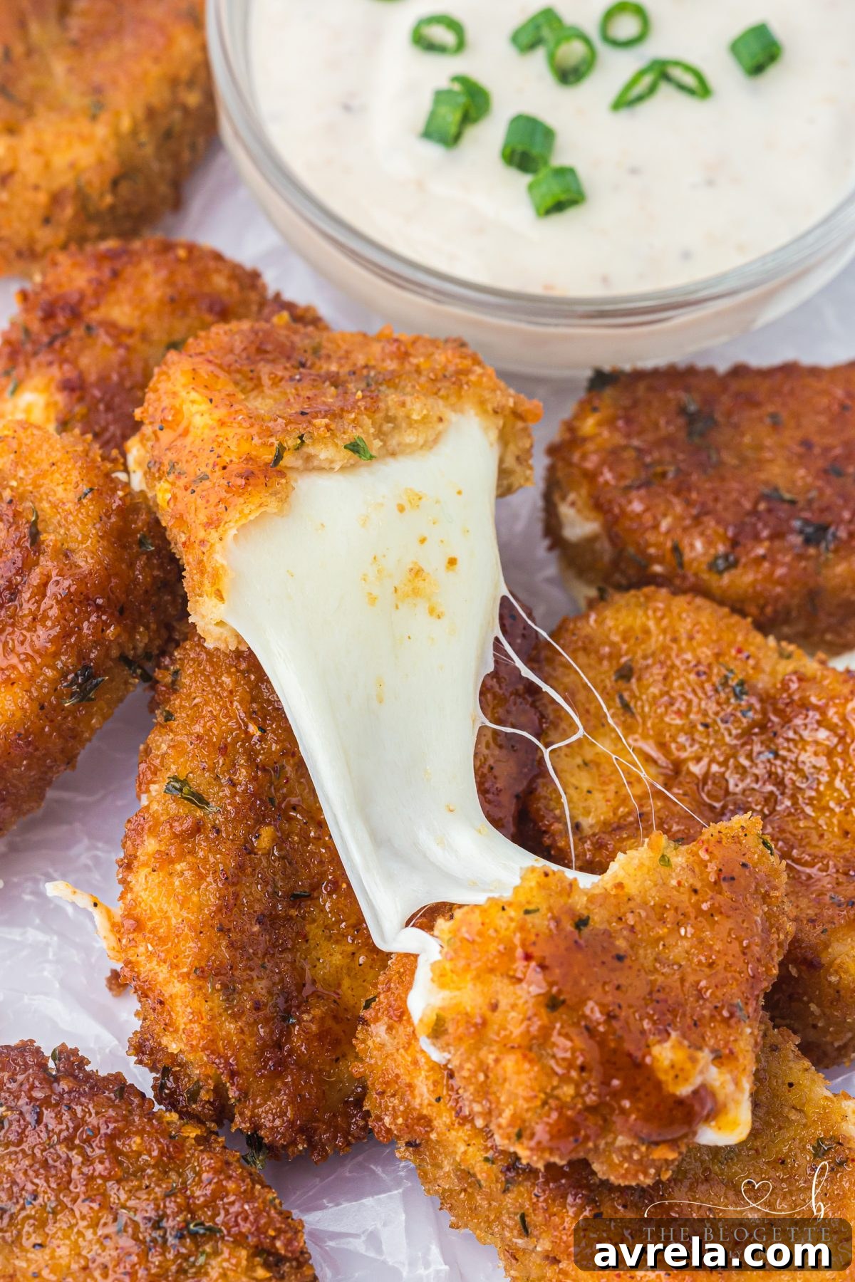 Plating of Nashville Hot Mozzarella Sticks, ready to be served as a delicious appetizer.
