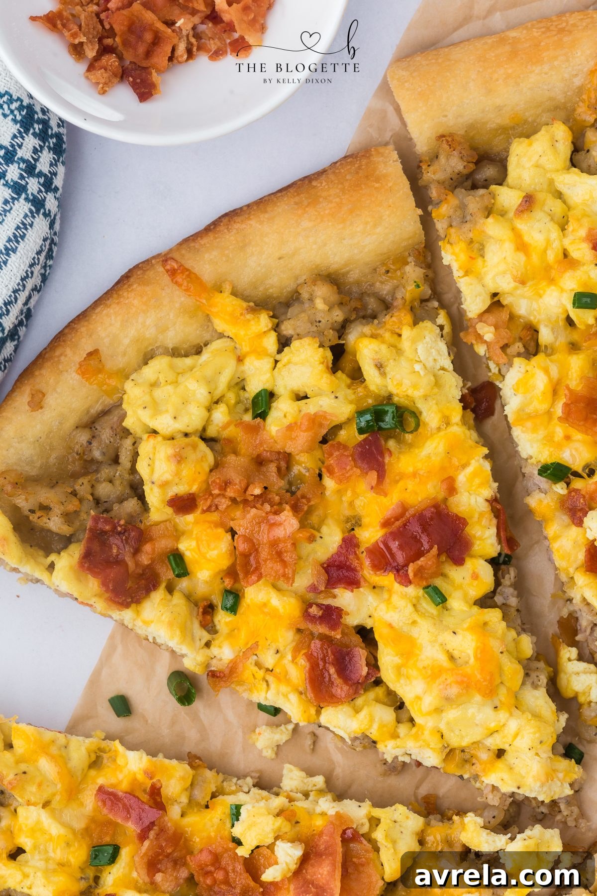 Rise and Shine Pizza 2 A delicious and cheesy breakfast pizza loaded with scrambled eggs, sausage, and crispy bacon on a golden crust. Perfect for brunch, weekends, or easy meal prep.