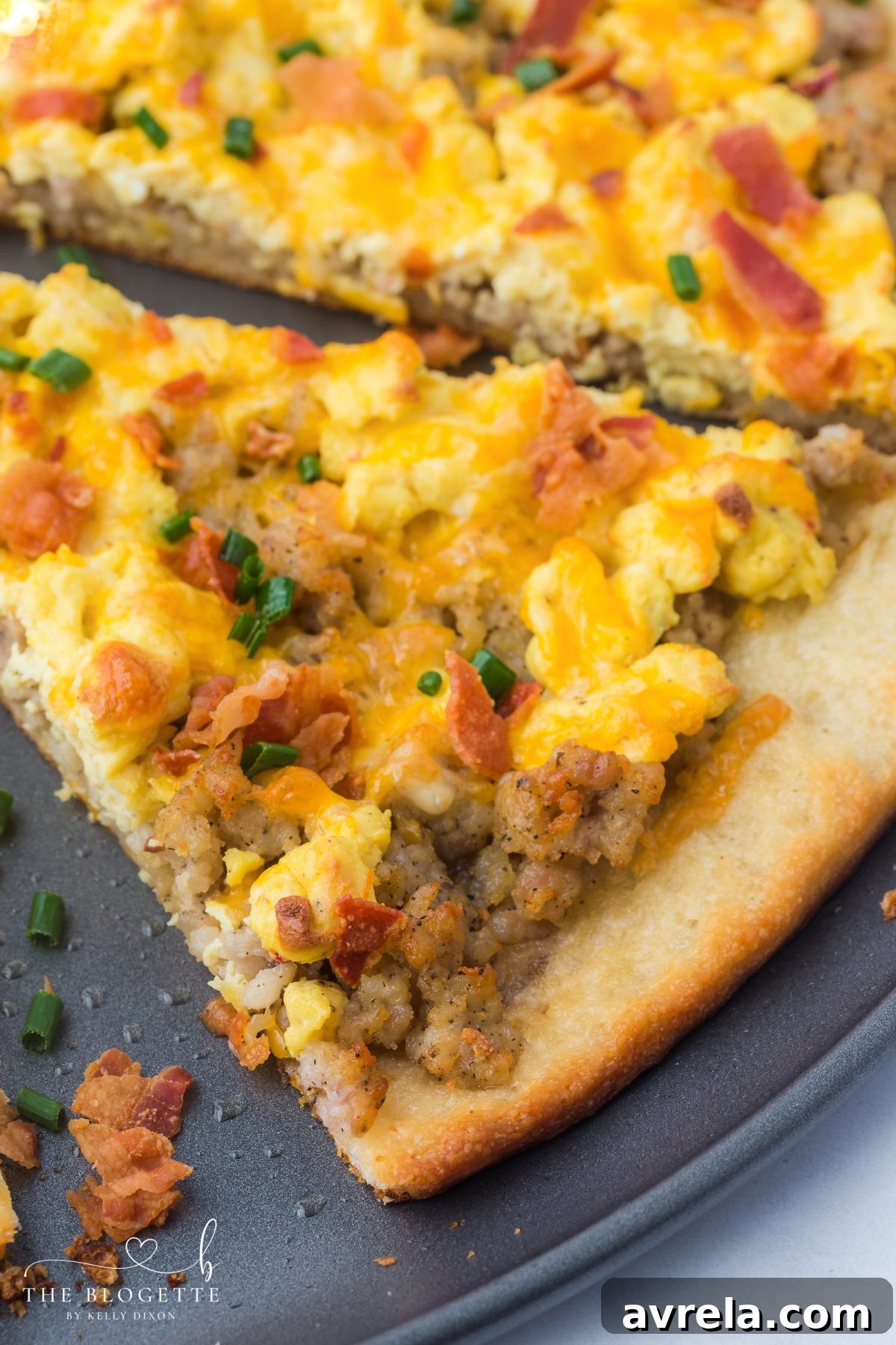 Rise and Shine Pizza 12 A large, delicious breakfast pizza with all the toppings, garnished with fresh chives, ready to be cut into slices.