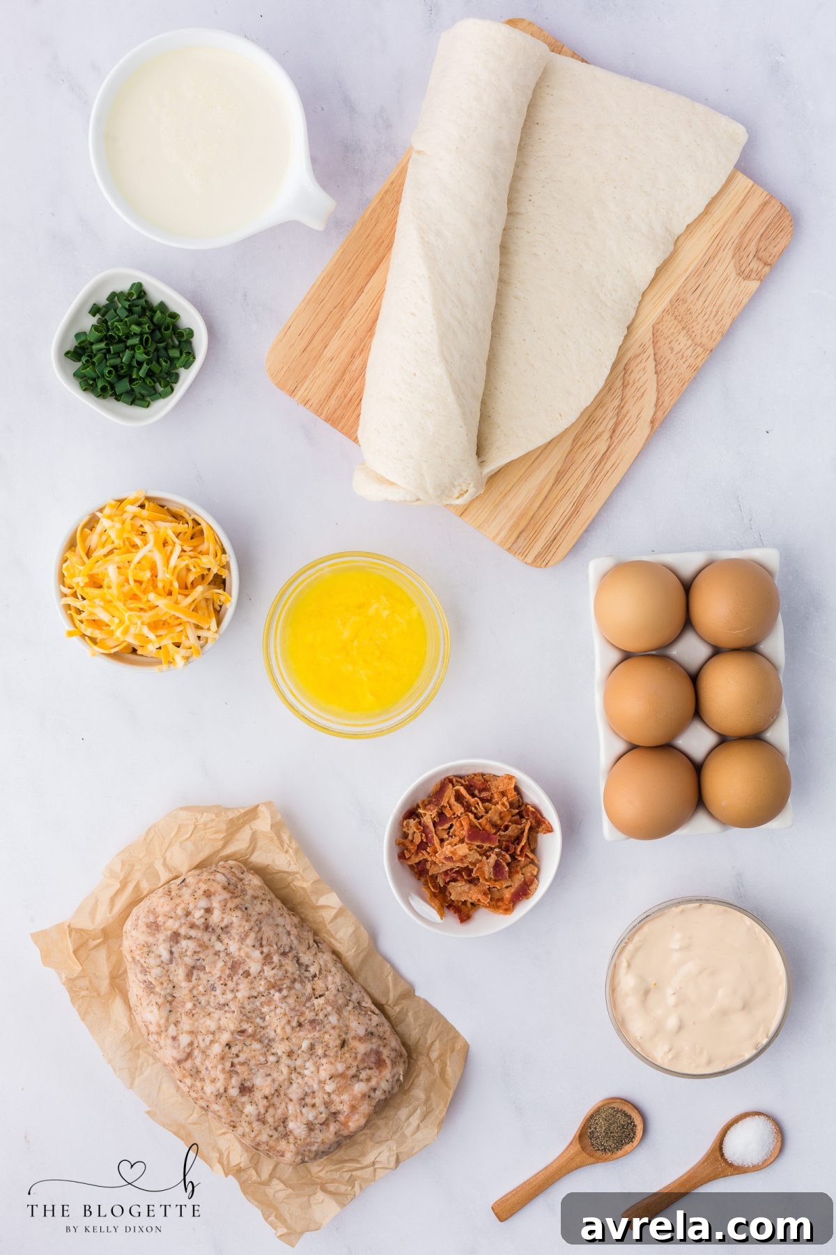 Rise and Shine Pizza 4 All the fresh ingredients laid out for making the breakfast pizza, including eggs, sausage, bacon, cheese, and pizza dough.