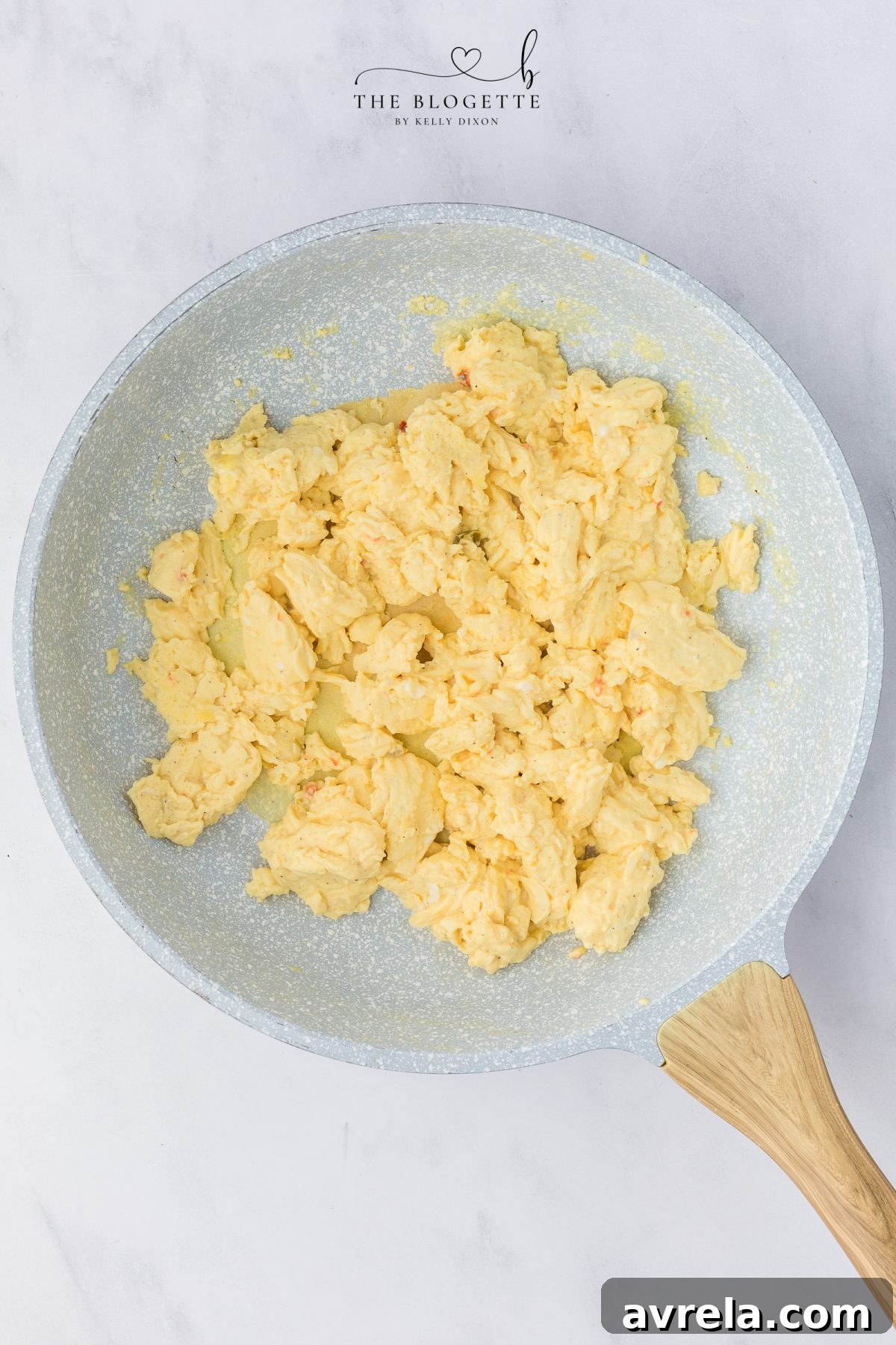 Rise and Shine Pizza 5 Cooking scrambled eggs in a nonstick skillet until fluffy and set.