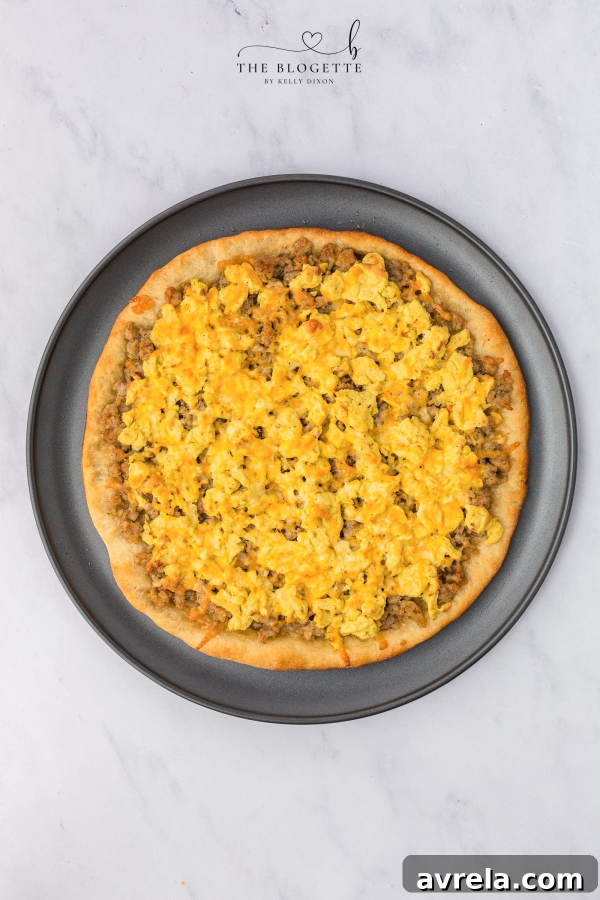 Rise and Shine Pizza 10 Freshly baked breakfast pizza with melted cheese, topped with bacon crumbles and chives.