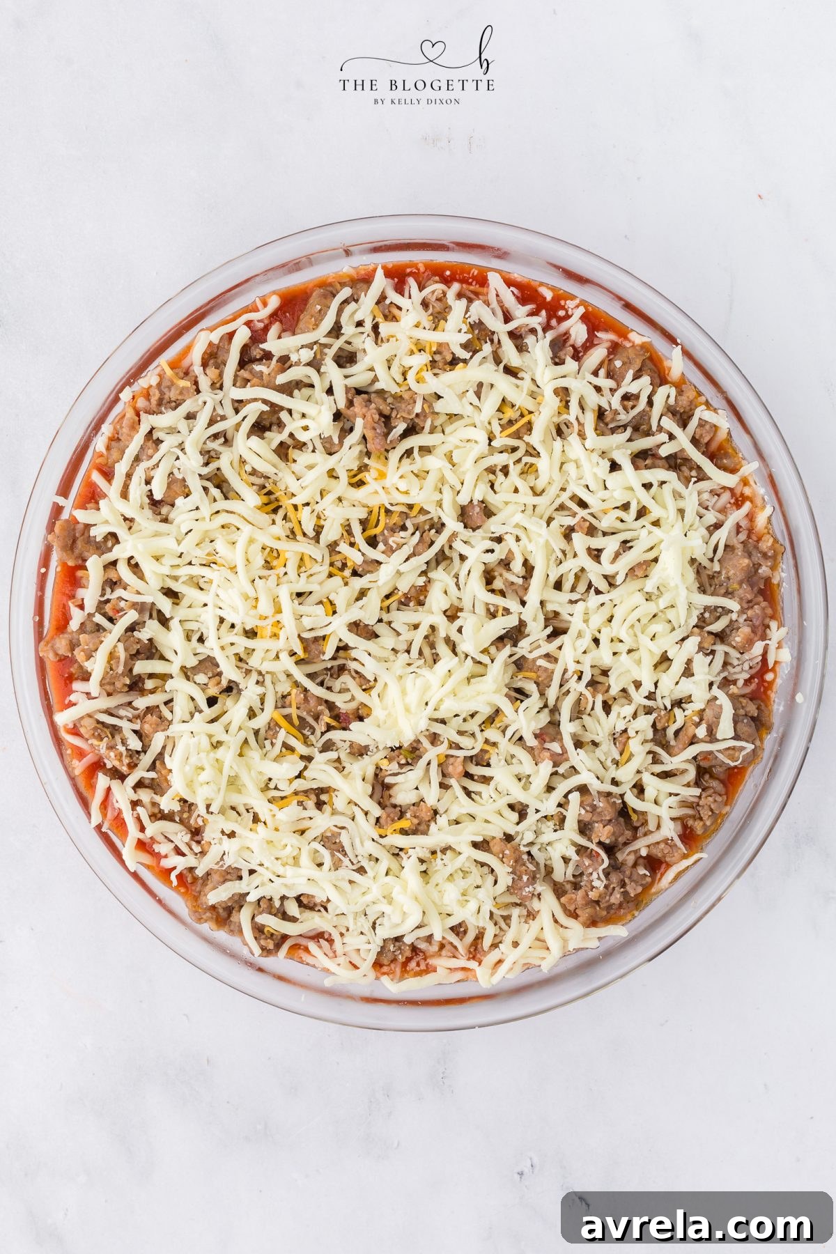Topping pizza dip with cheeses and mini pepperonis