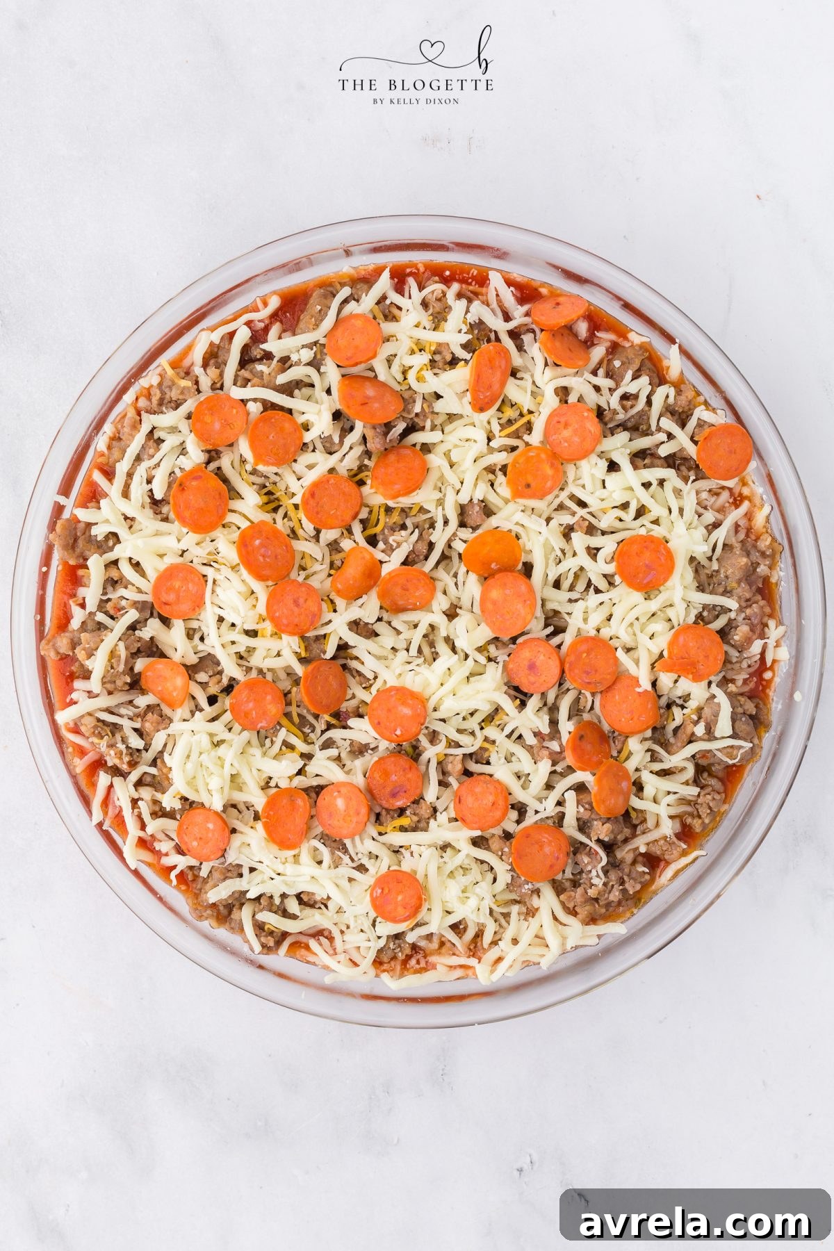 Pizza dip ready for baking with all toppings