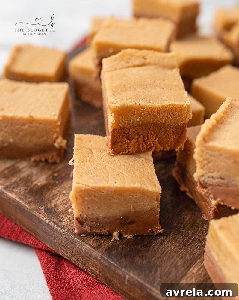 Close-up of a stack of chocolate peanut butter fudge squares, ready to be eaten